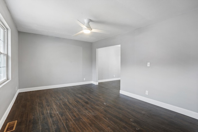 unfurnished room featuring dark hardwood / wood-style floors and ceiling fan