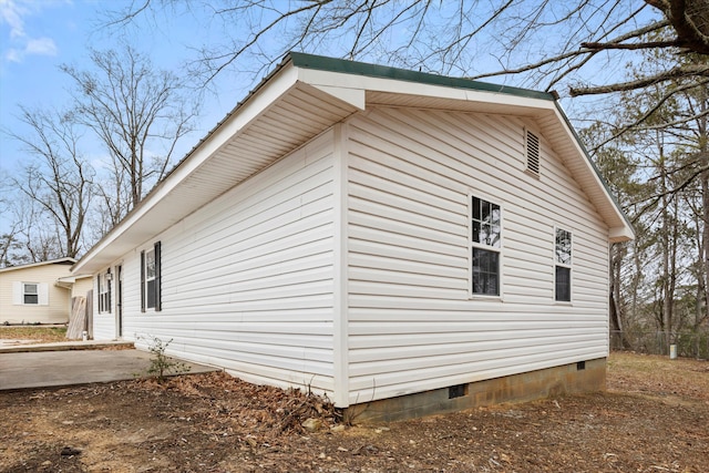 view of side of property featuring a patio