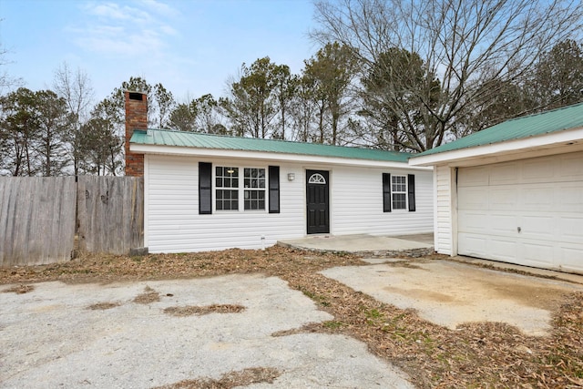 ranch-style house featuring a garage