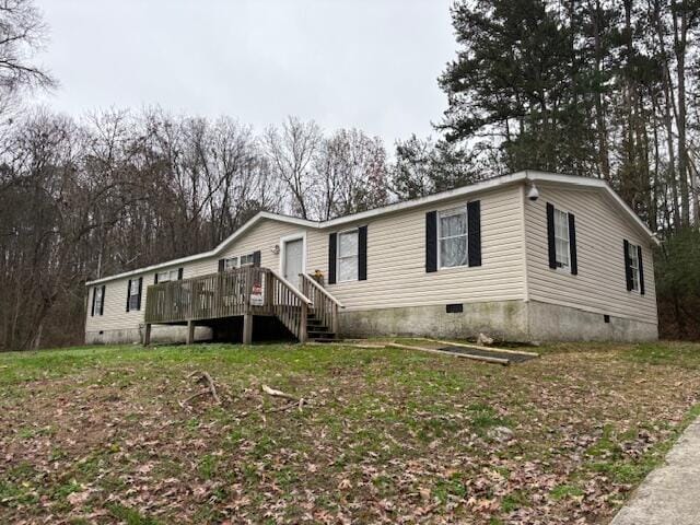 manufactured / mobile home featuring a wooden deck