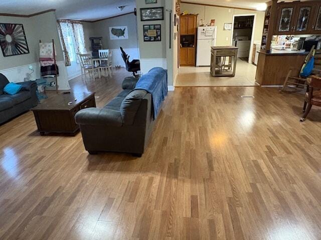 living room featuring ornamental molding and hardwood / wood-style flooring