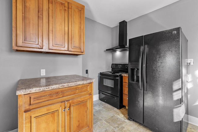 kitchen featuring wall chimney exhaust hood and black appliances