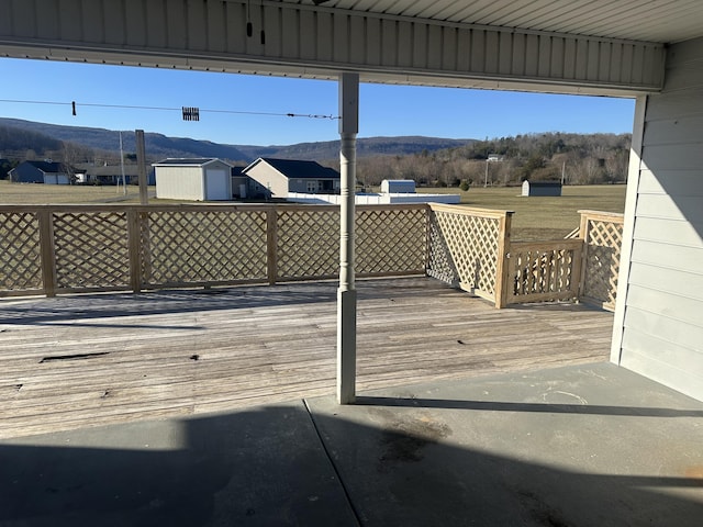 wooden deck with a mountain view