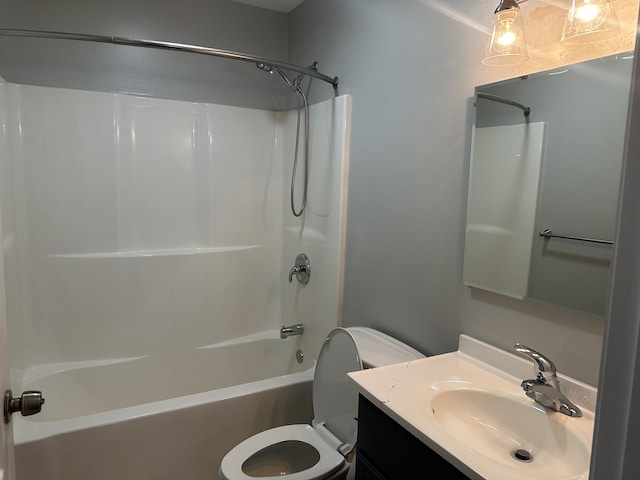 full bathroom featuring vanity, tub / shower combination, and toilet