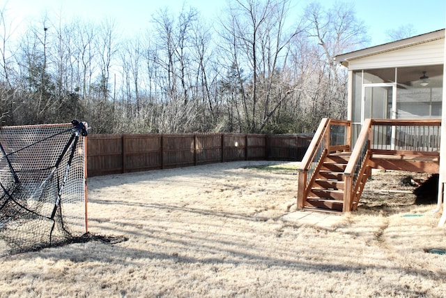 view of yard with a sunroom