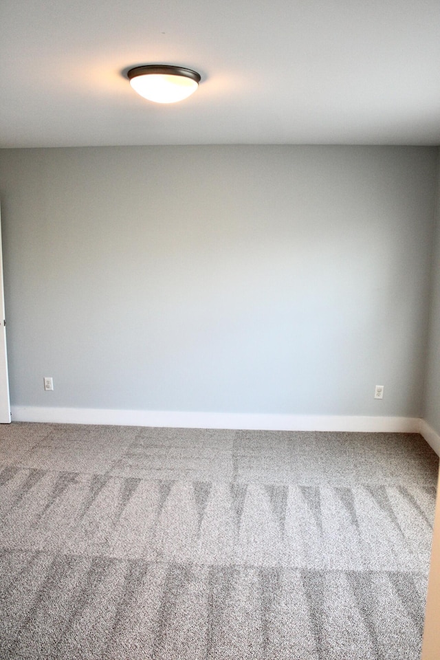 spare room featuring carpet floors