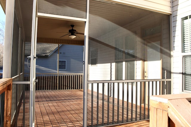 wooden terrace featuring ceiling fan