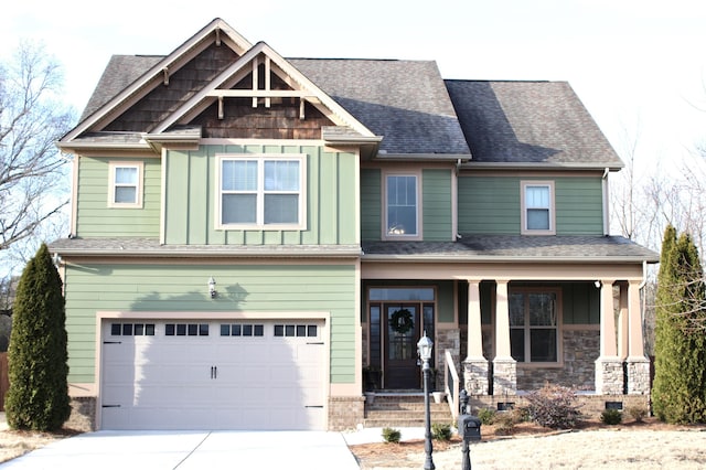 craftsman-style house featuring a garage and covered porch