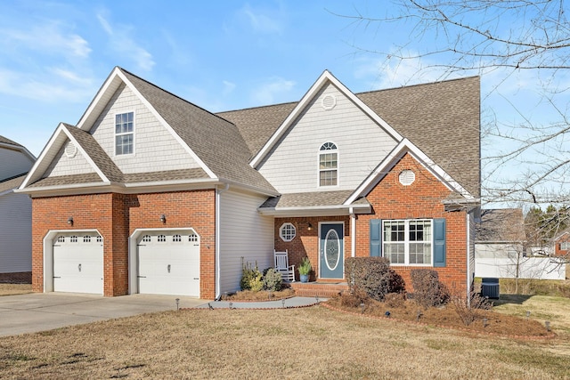 view of front of house with central AC unit, a garage, and a front lawn