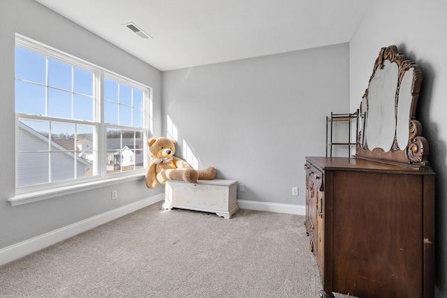 living area with light colored carpet