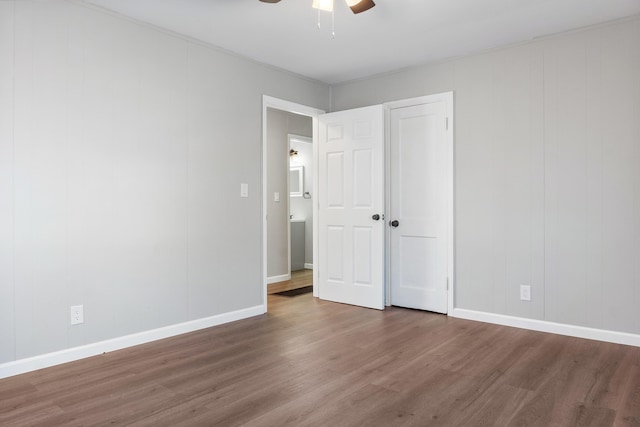 unfurnished bedroom featuring hardwood / wood-style flooring and ceiling fan