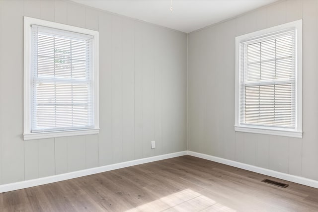 empty room with light hardwood / wood-style floors