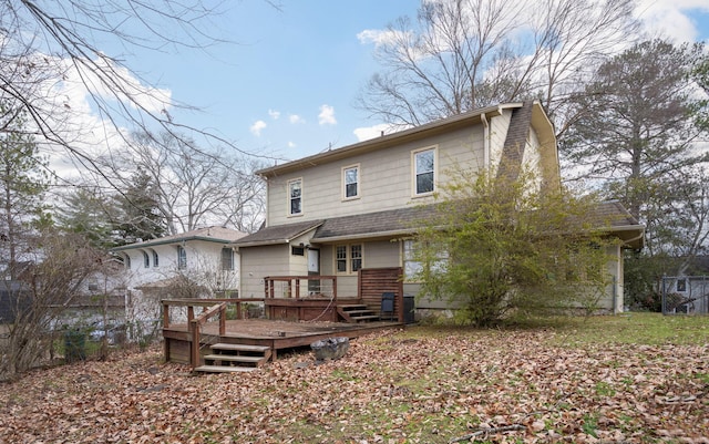 back of house with a wooden deck