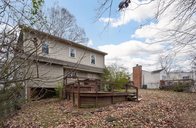 rear view of house featuring a deck