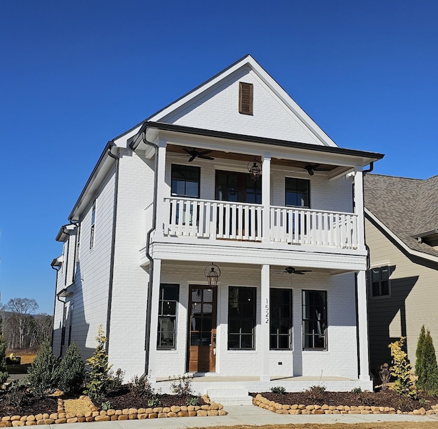 view of front facade featuring ceiling fan, a balcony, and a porch