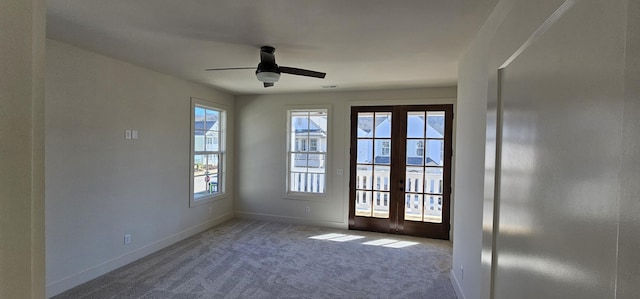 doorway with carpet floors, ceiling fan, and french doors