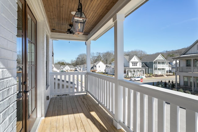 wooden deck with a residential view