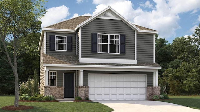 view of front of property featuring a garage and a front lawn