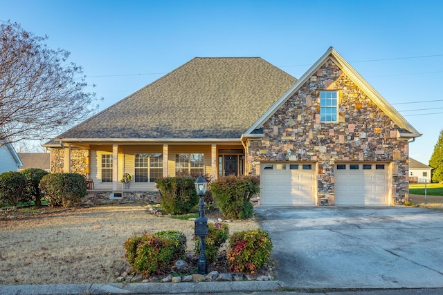 view of front of house featuring a porch and a garage