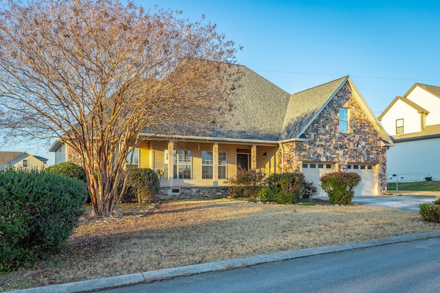 view of front of house with a porch and a garage