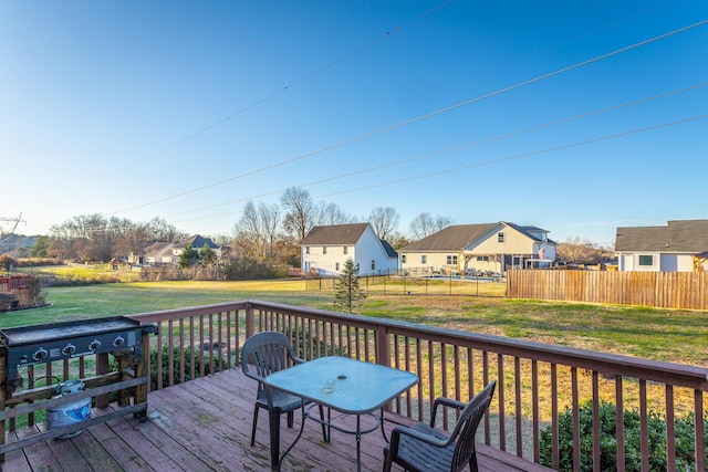 deck featuring a yard and a grill