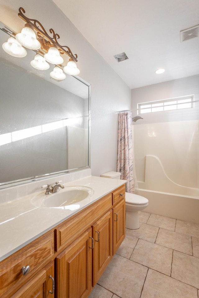 full bathroom featuring tile patterned flooring, shower / bath combo, vanity, and toilet