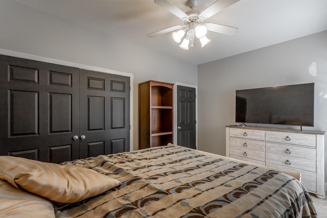 bedroom featuring ceiling fan and a closet