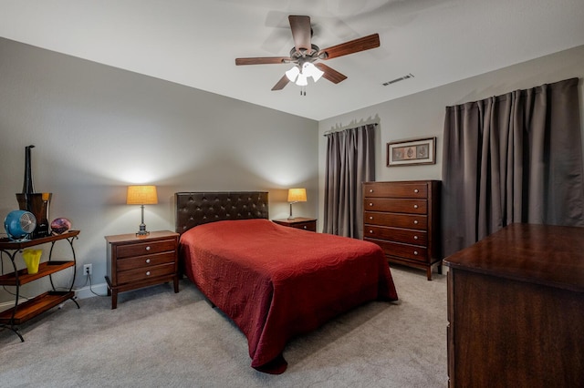 bedroom with ceiling fan, carpet flooring, and visible vents