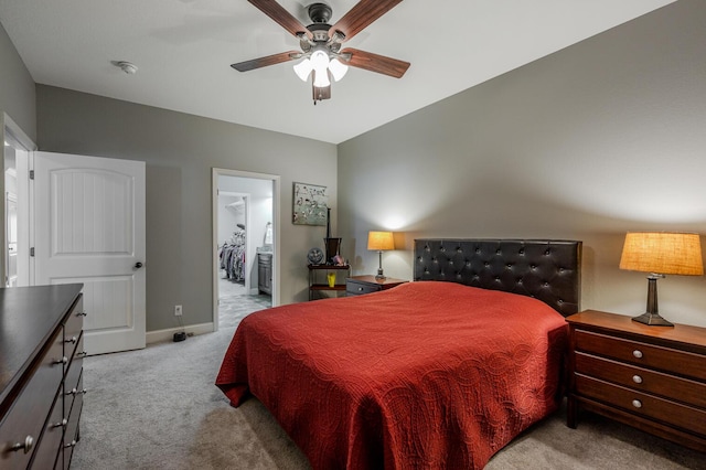 carpeted bedroom with baseboards and a ceiling fan