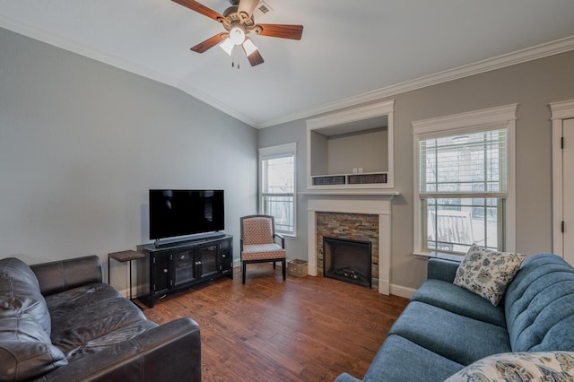 living area with vaulted ceiling, plenty of natural light, wood finished floors, and crown molding