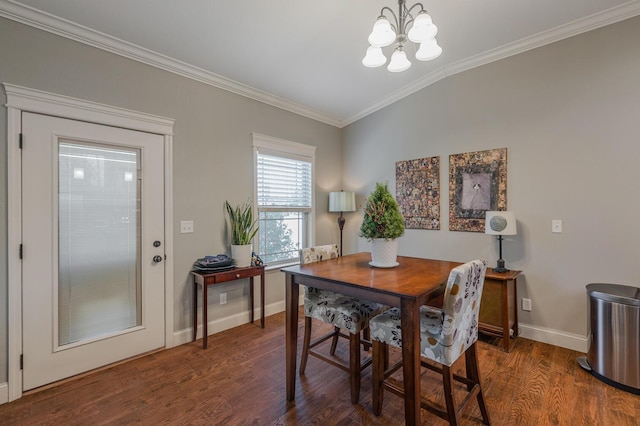 dining space featuring baseboards, wood finished floors, vaulted ceiling, crown molding, and a notable chandelier