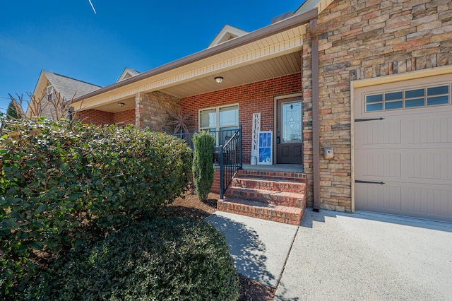 property entrance featuring an attached garage, stone siding, a porch, and brick siding