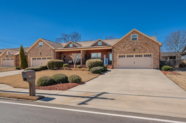 view of front of home with concrete driveway and brick siding