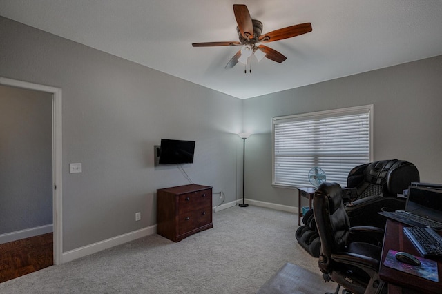 office with carpet, baseboards, and a ceiling fan