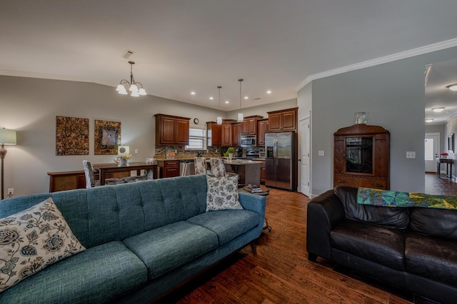 living room with ornamental molding, recessed lighting, dark wood finished floors, and an inviting chandelier