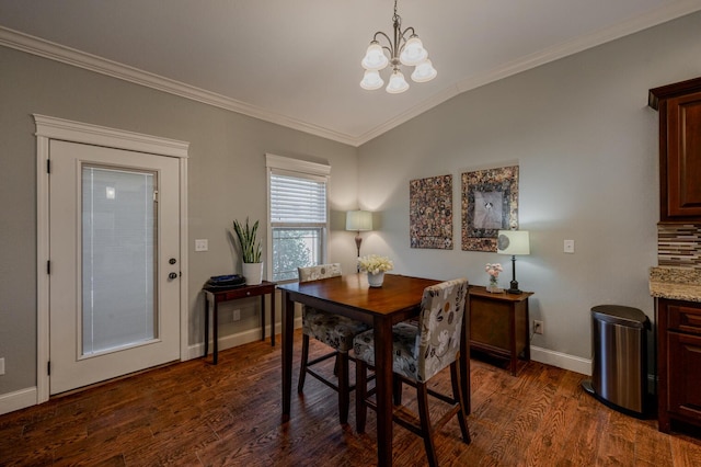 dining space with dark wood-type flooring, a notable chandelier, ornamental molding, and baseboards