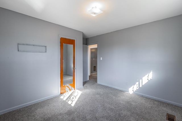 unfurnished bedroom with carpet flooring