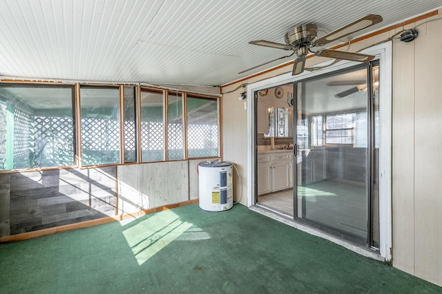 unfurnished sunroom with ceiling fan and plenty of natural light