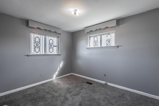 spare room featuring carpet floors