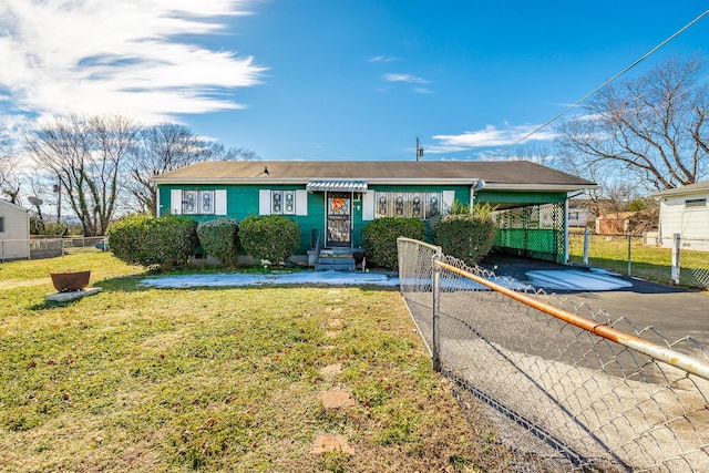 single story home featuring a carport and a front yard