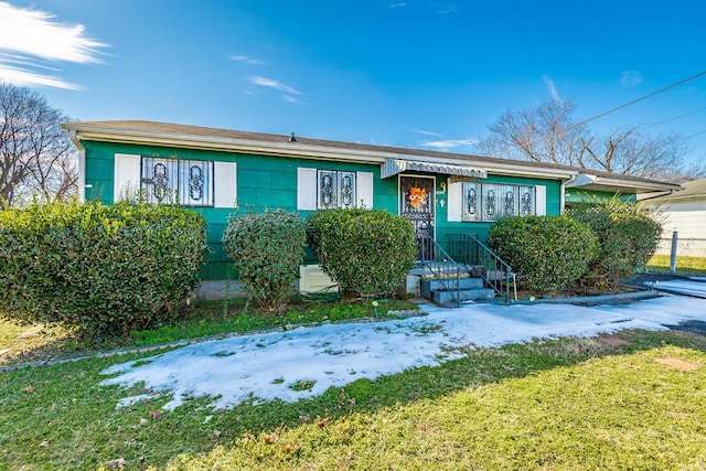 ranch-style house with a front yard