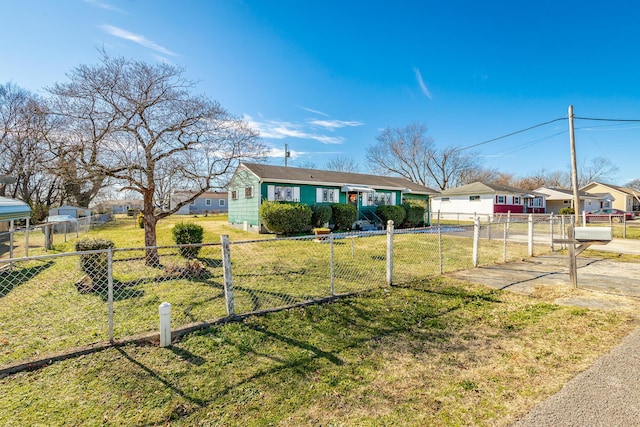 ranch-style home with a front lawn