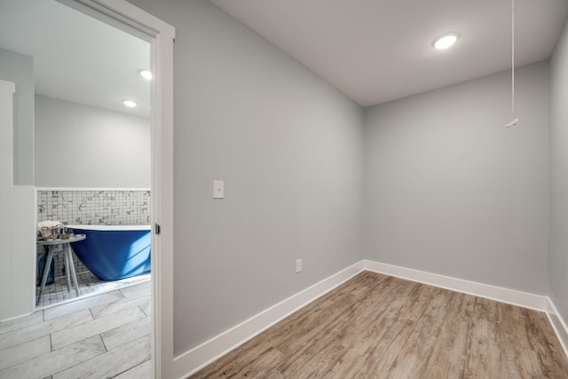 spare room featuring light wood-type flooring