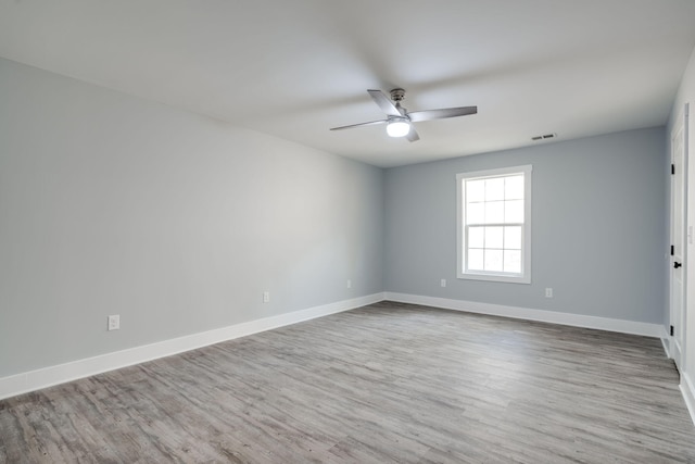 unfurnished room featuring ceiling fan and light wood-type flooring