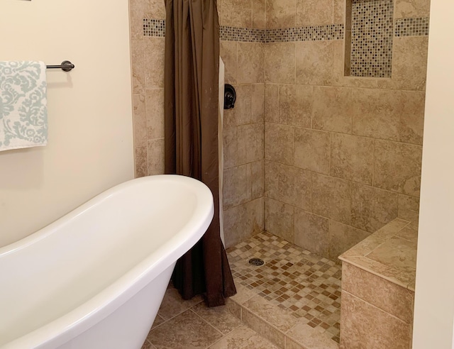 bathroom featuring separate shower and tub