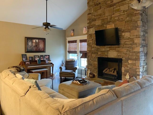 living room featuring a stone fireplace, ceiling fan, high vaulted ceiling, and hardwood / wood-style flooring