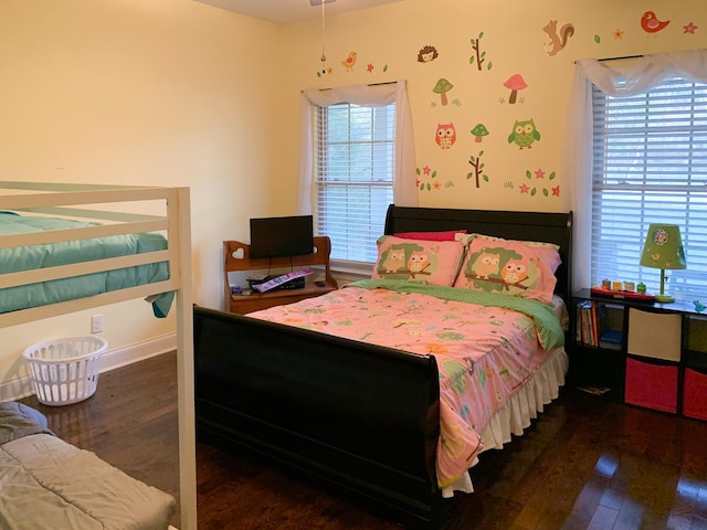 bedroom featuring dark hardwood / wood-style flooring