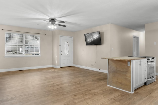 interior space featuring ceiling fan and light wood-type flooring