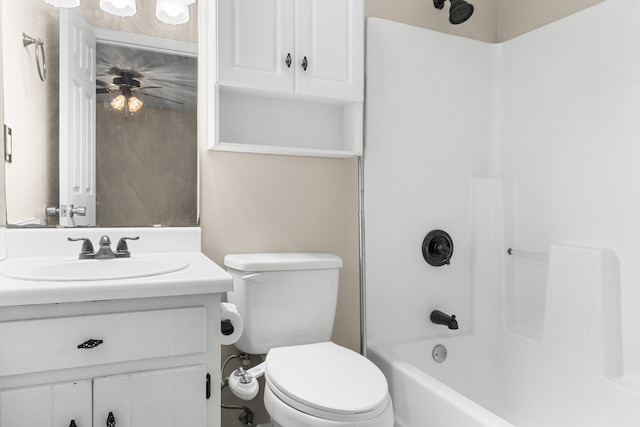 full bathroom featuring vanity, bathing tub / shower combination, and toilet