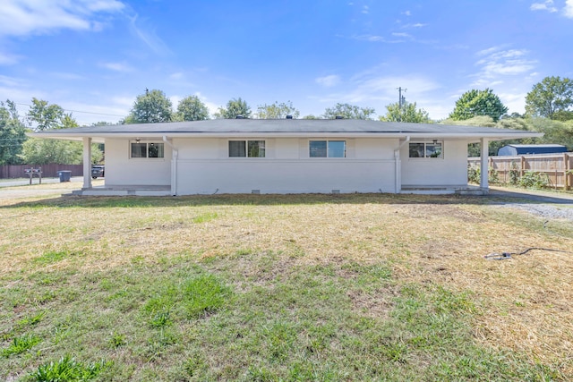 ranch-style house with a patio area and a front lawn